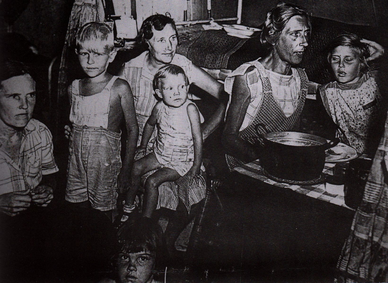 Half-starved women and children in one of the Dutch East Indies camps